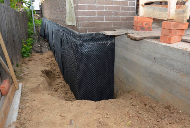 Happy homeowners after waterproofing job in Dillsboro